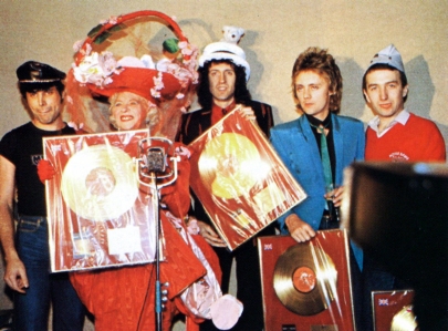 the-band-were-presented-with-gold-disc-awards-by-gertrude-shilling-at-the-crazy-hat-party-in-london-in-december-1979.jpg?w=405